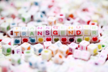 transgender spelled out with beads