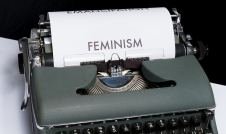 The word "feminism" typed out on a type writer