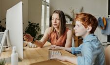 mother and son on a computer