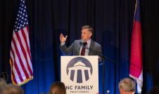 Joseph Backholm speaking at a lecturn at NC Family's Winston-Salem Dinner