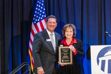 John Rustin awarding Joyce Krawiec Life & Liberty Award