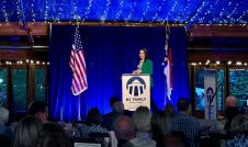 Katy Faust speaking at the Angus Barn Pavilion during NC Family's Raleigh dinner