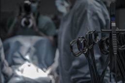 Doctors performing surgery in scrubs