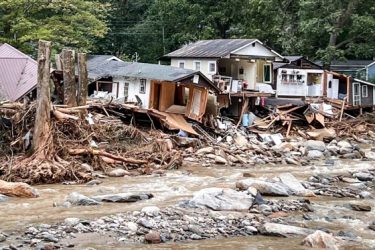 Damaged homes wrecked by Helene in Lake Lure, N.C. Photo From NBC News, George Carter